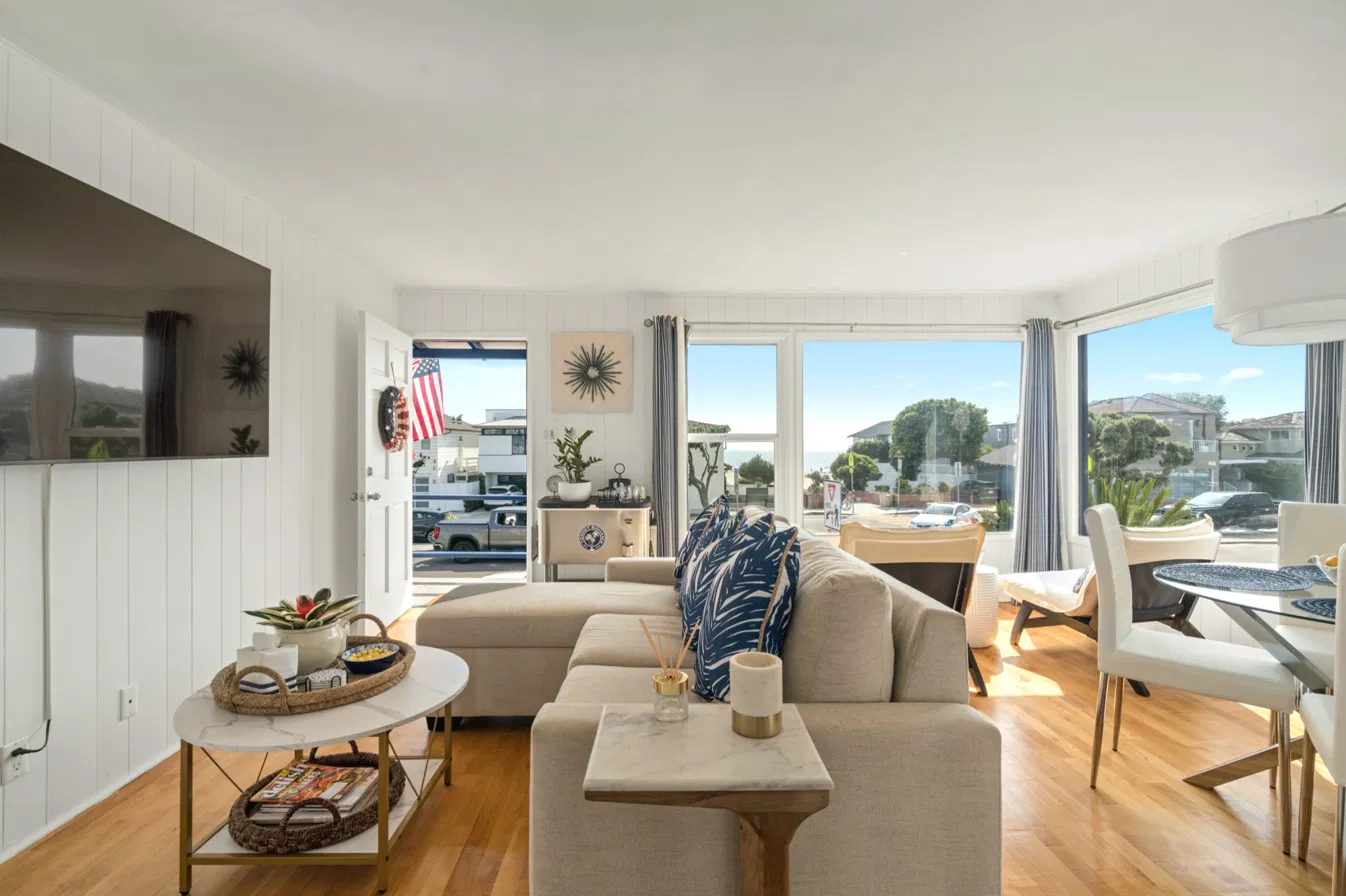Sunny lower two-bedroom beach bungalow living and dining room
